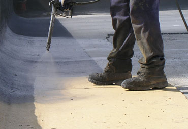 Coating systems over Billings spray foam roof systems